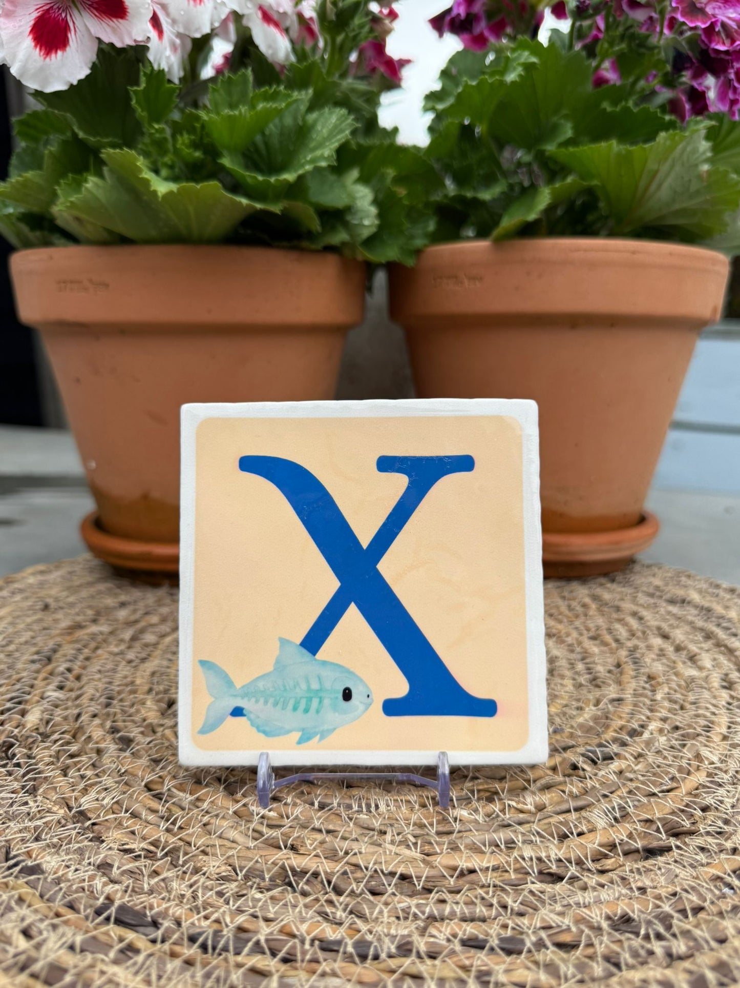 Tegeltje X